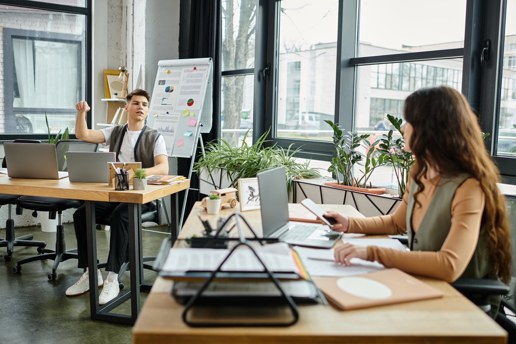 A ministry team collaborating in a bright, plant-filled workspace