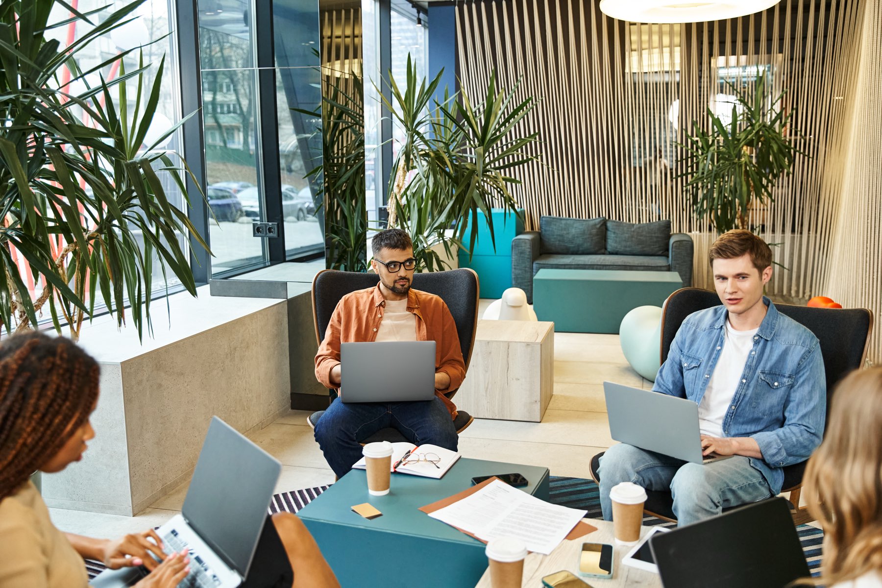 A startup team building together in a warm, focused office